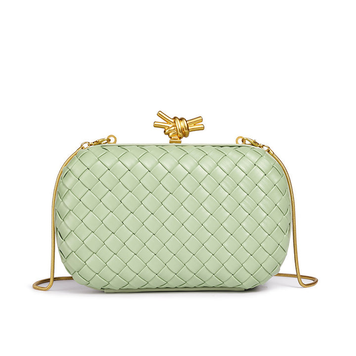 THE REFINED BARREL DUFFEL CLUTCH