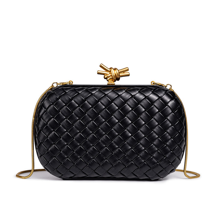 THE REFINED BARREL DUFFEL CLUTCH