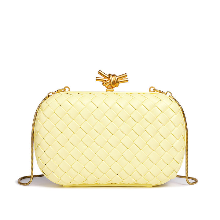 THE REFINED BARREL DUFFEL CLUTCH