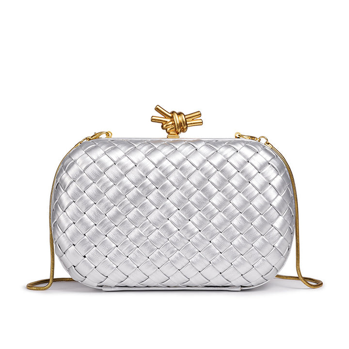 THE REFINED BARREL DUFFEL CLUTCH