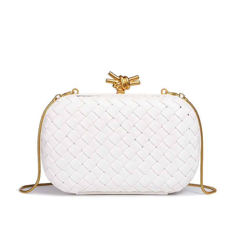 THE REFINED BARREL DUFFEL CLUTCH
