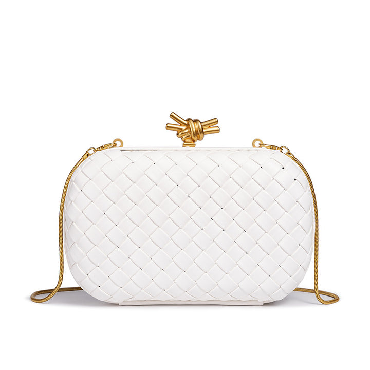 THE REFINED BARREL DUFFEL CLUTCH