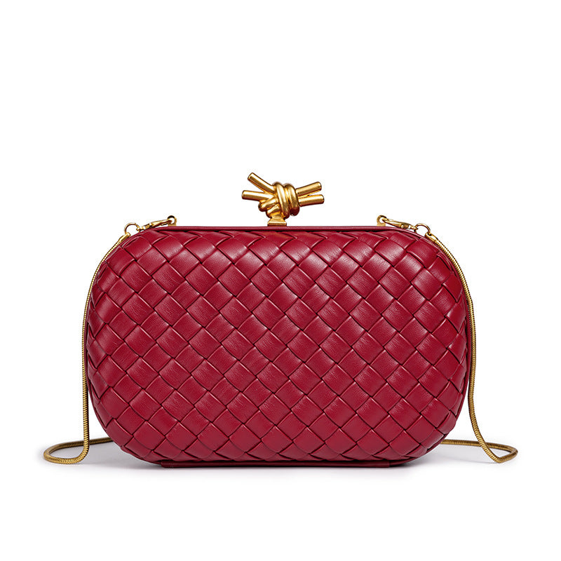THE REFINED BARREL DUFFEL CLUTCH