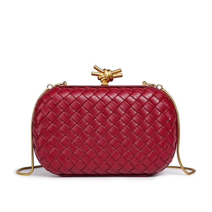 THE REFINED BARREL DUFFEL CLUTCH