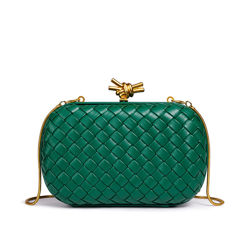 THE REFINED BARREL DUFFEL CLUTCH