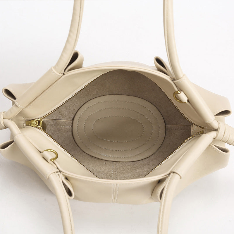 THE SCULPTURAL PLEATED DUMPLING BAG