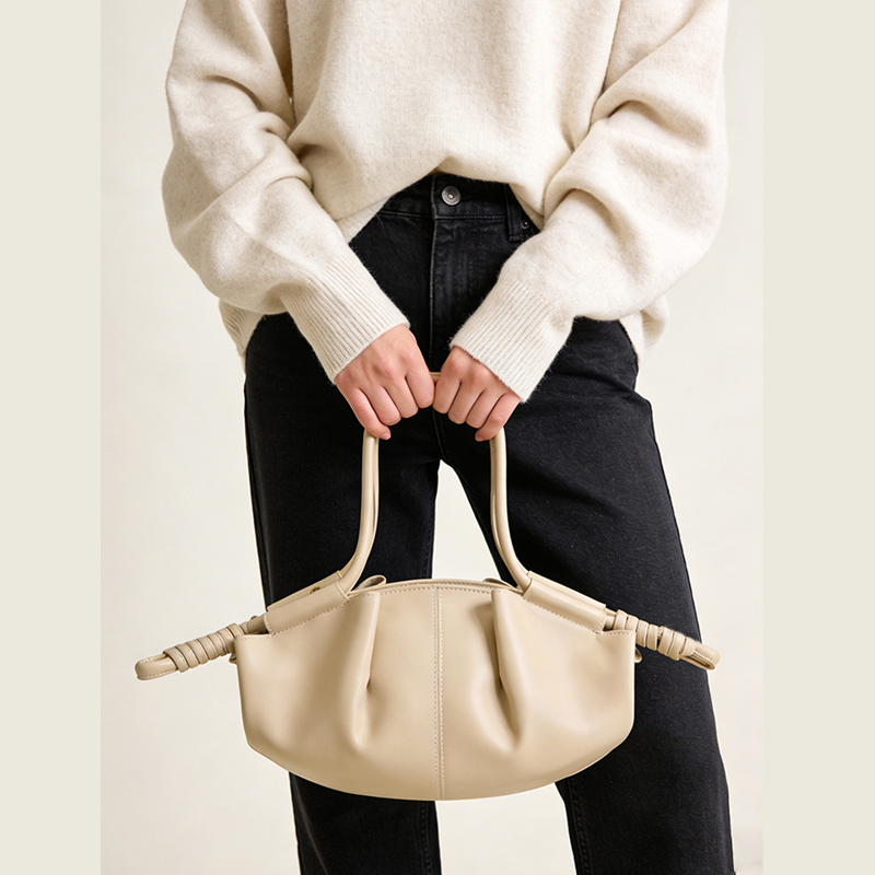 THE SCULPTURAL PLEATED DUMPLING BAG