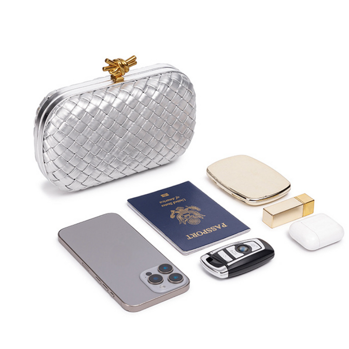 THE REFINED BARREL DUFFEL CLUTCH