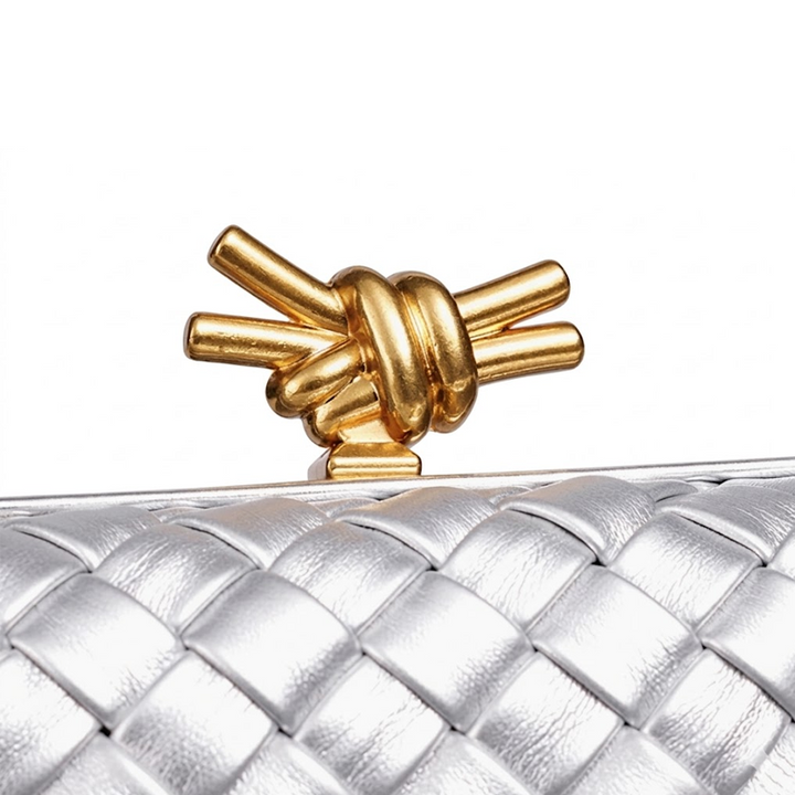 THE REFINED BARREL DUFFEL CLUTCH