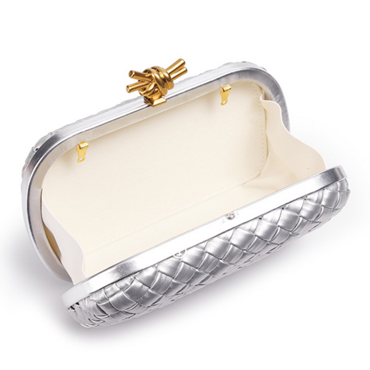 THE REFINED BARREL DUFFEL CLUTCH