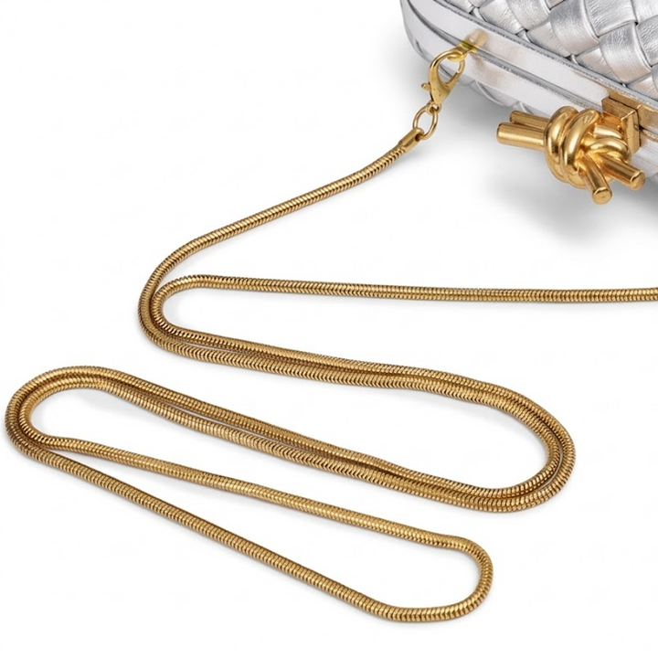 THE REFINED BARREL DUFFEL CLUTCH