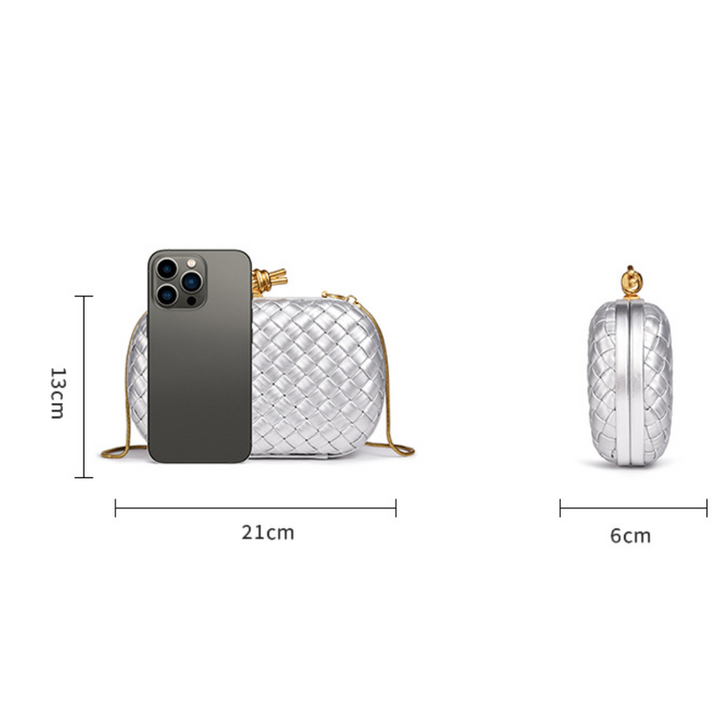THE REFINED BARREL DUFFEL CLUTCH